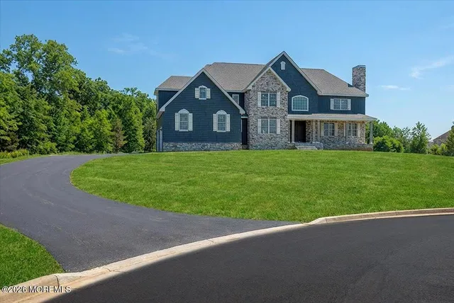 a front view of a house with yard