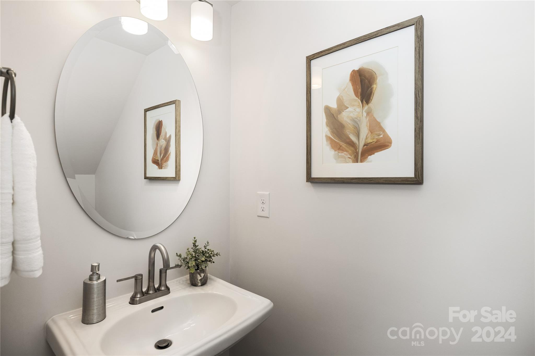 2733 Capitol Drive Charlotte, NC 28208 - Photo 13 of 20 a bathroom with a sink and a mirror