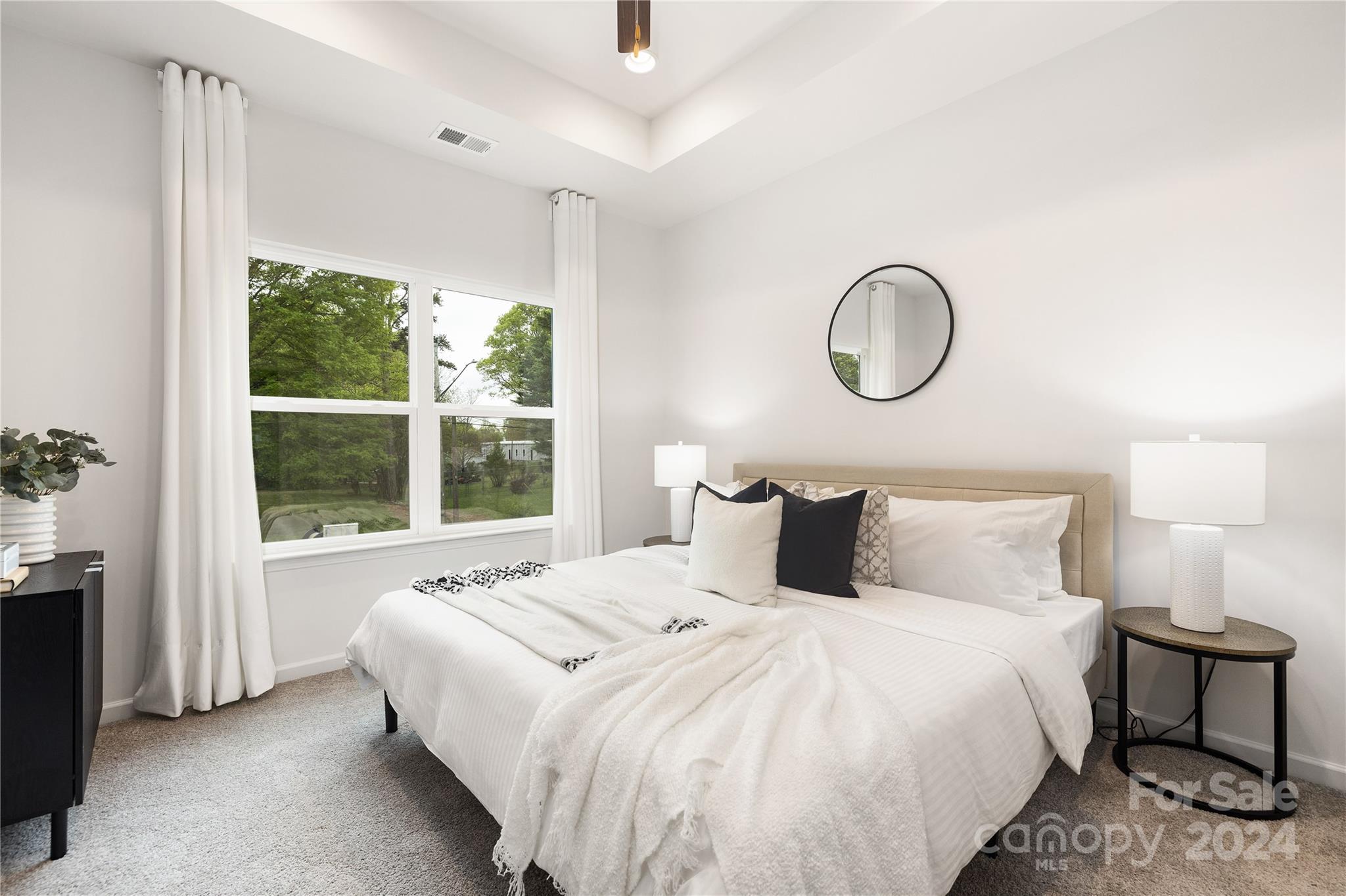 2733 Capitol Drive Charlotte, NC 28208 - Photo 10 of 20 a bedroom with a large bed and a window