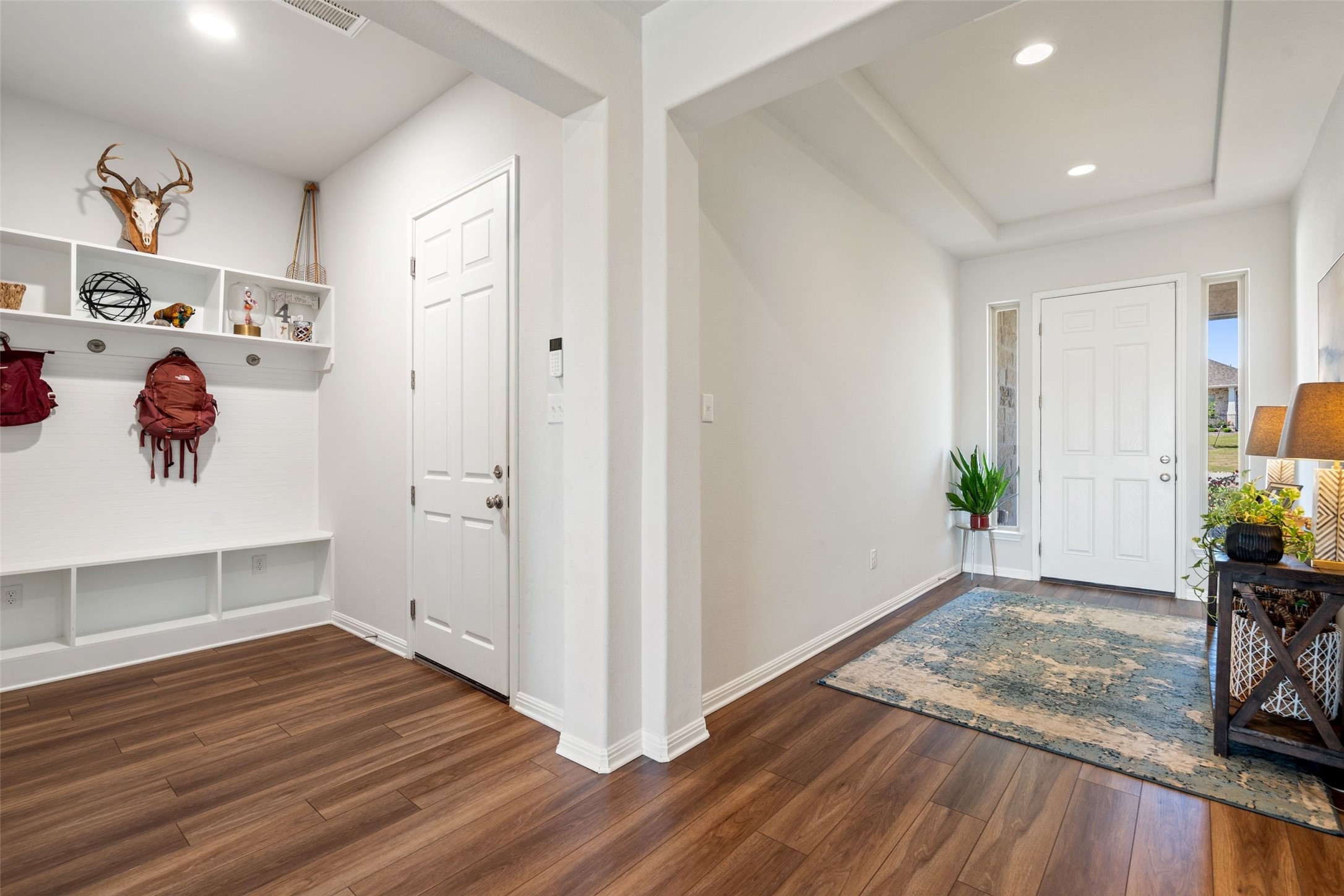 162 Lunar Loop Austin, TX 78737 - Photo 18 of 40 a view of a hallway view with wooden floor and a living room