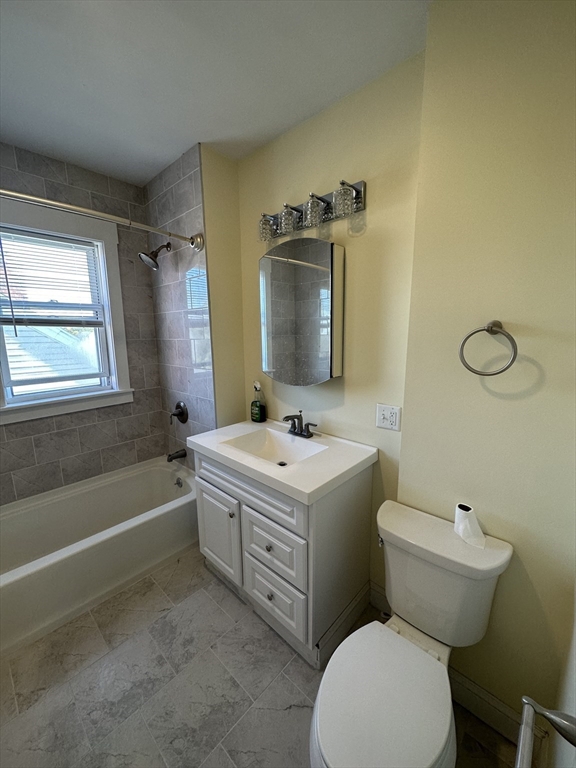 35 George Street, Unit 3 Everett, MA 02149 - Photo 14 of 34 a bathroom with a sink toilet vanity and tub