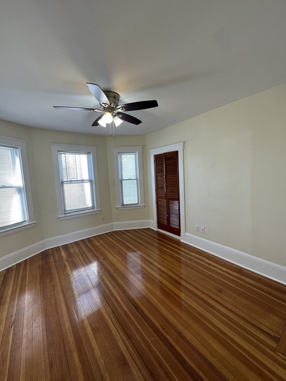 35 George Street, Unit 3 Everett, MA 02149 - Photo 21 of 34 a view of an empty room with wooden floor and a window