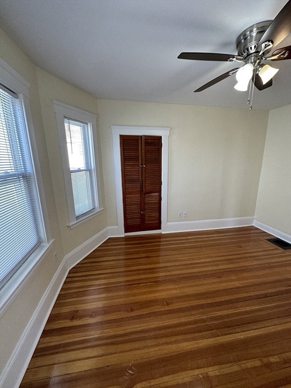 35 George Street, Unit 3 Everett, MA 02149 - Photo 23 of 34 a view of an empty room with wooden floor and a window