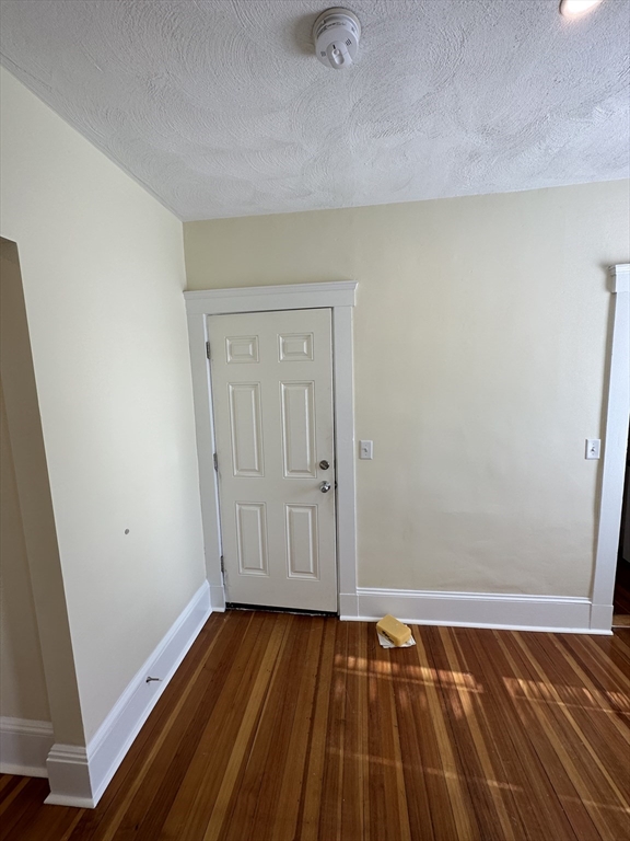 35 George Street, Unit 3 Everett, MA 02149 - Photo 32 of 34 a view of a room with wooden floor and cabinet