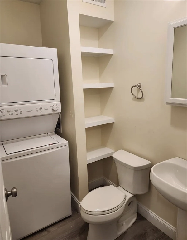 35 George Street, Unit 3 Everett, MA 02149 - Photo 34 of 34 a white toilet sitting next to a bathroom sink