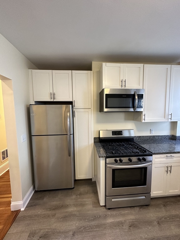 35 George Street, Unit 3 Everett, MA 02149 - Photo 5 of 34 a kitchen with cabinets and steel stainless steel appliances
