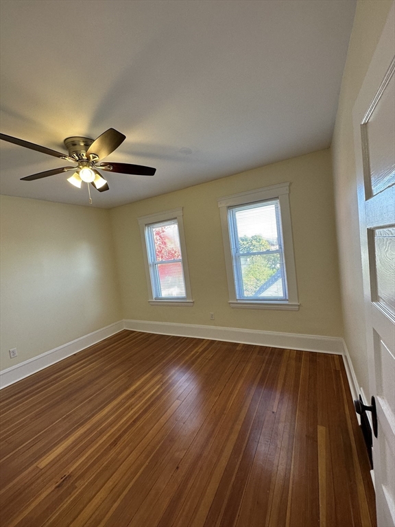 35 George Street, Unit 3 Everett, MA 02149 - Photo 10 of 34 wooden floor in an empty room with a window