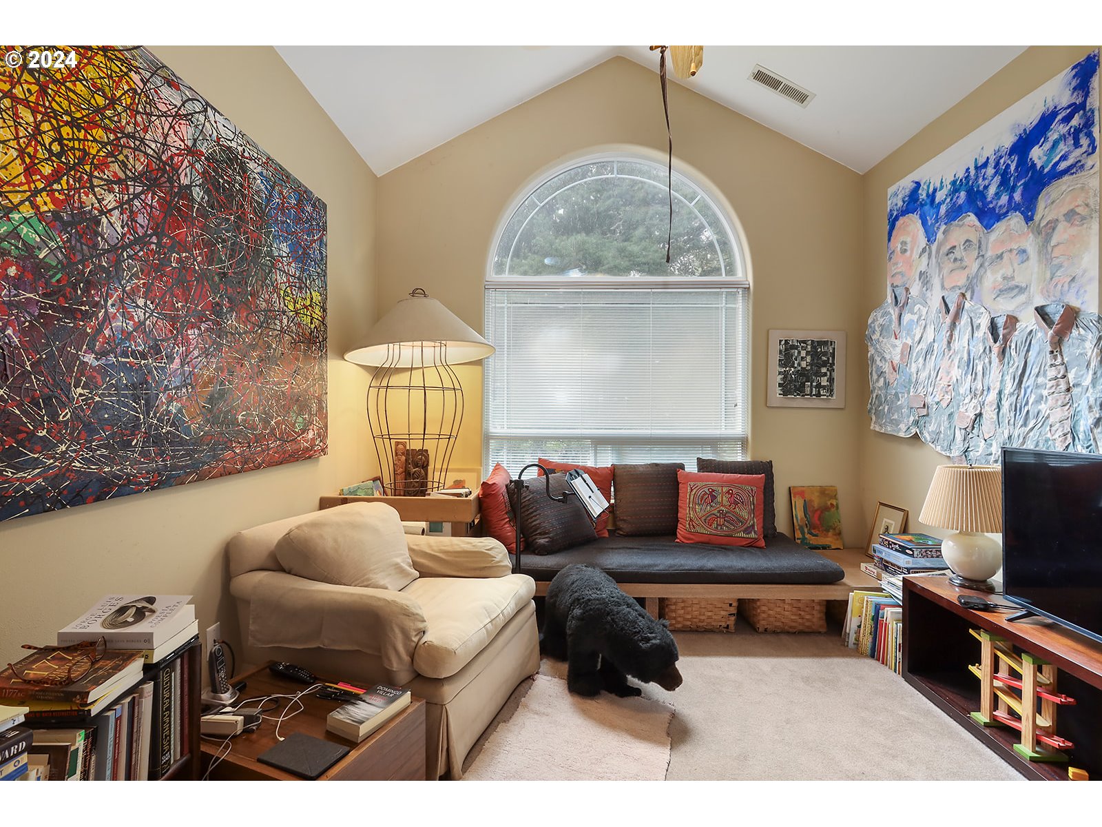 1190 Methodist Road Hood River, OR 97031 - Photo 21 of 41 a living room with furniture a flat screen tv and a wall painting