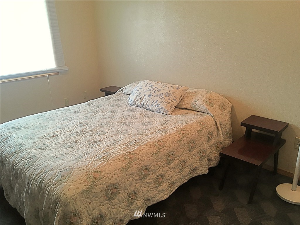 44 Beach Court Decatur Island, WA 98221 - Photo 12 of 25 a bed sitting in a bedroom next to a window