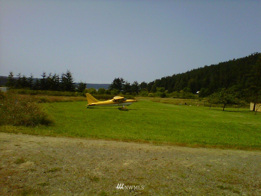 44 Beach Court Decatur Island, WA 98221 - Photo 25 of 25 a view of a golf course with a lake