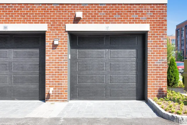 a bed room with a bed and a painting on the wall