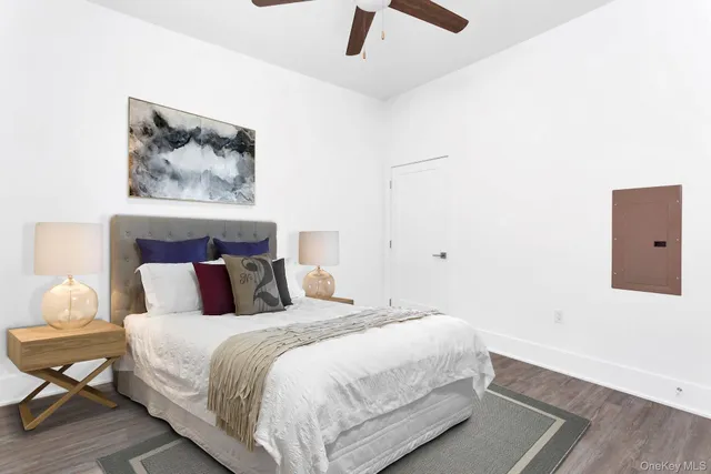 a view of a dining room with furniture and a potted plant