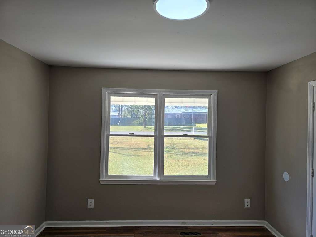 123 Preston Drive Fitzgerald, GA 31750 - Photo 14 of 24 a view of an empty room with a window
