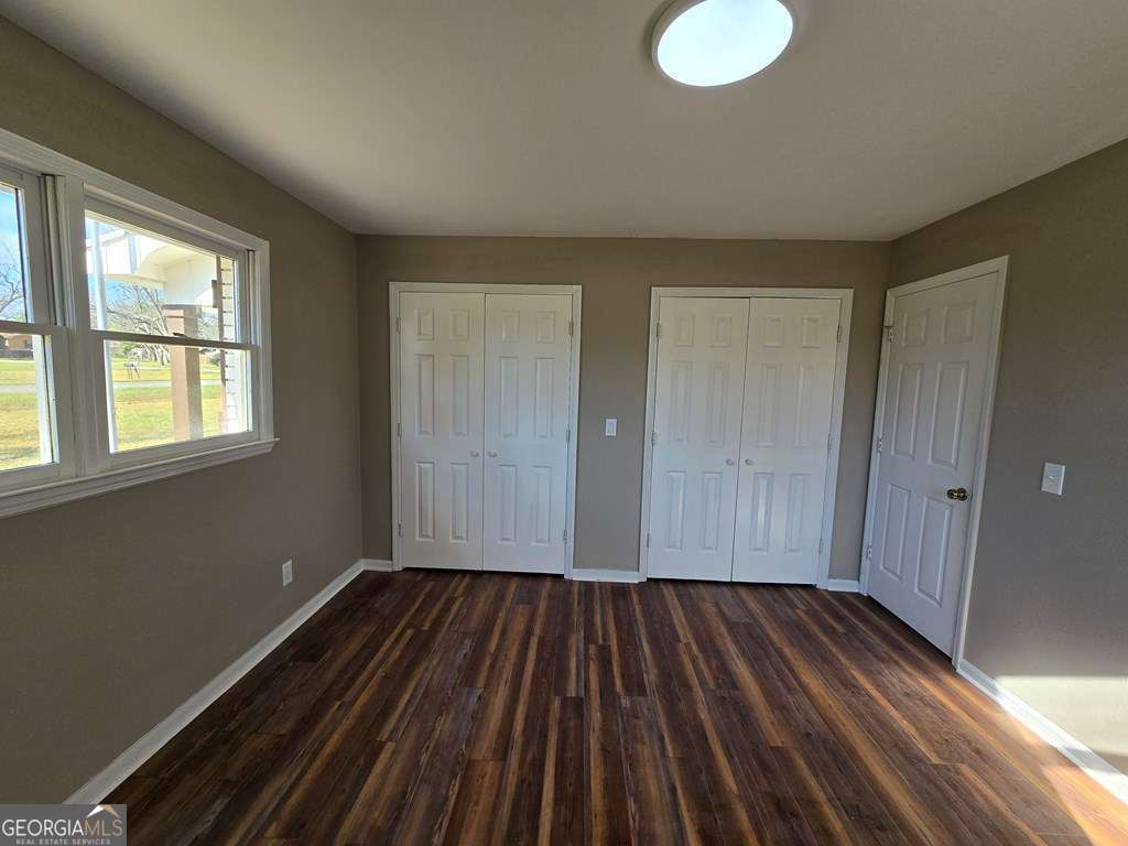 123 Preston Drive Fitzgerald, GA 31750 - Photo 18 of 24 a view of a room with wooden floor and window