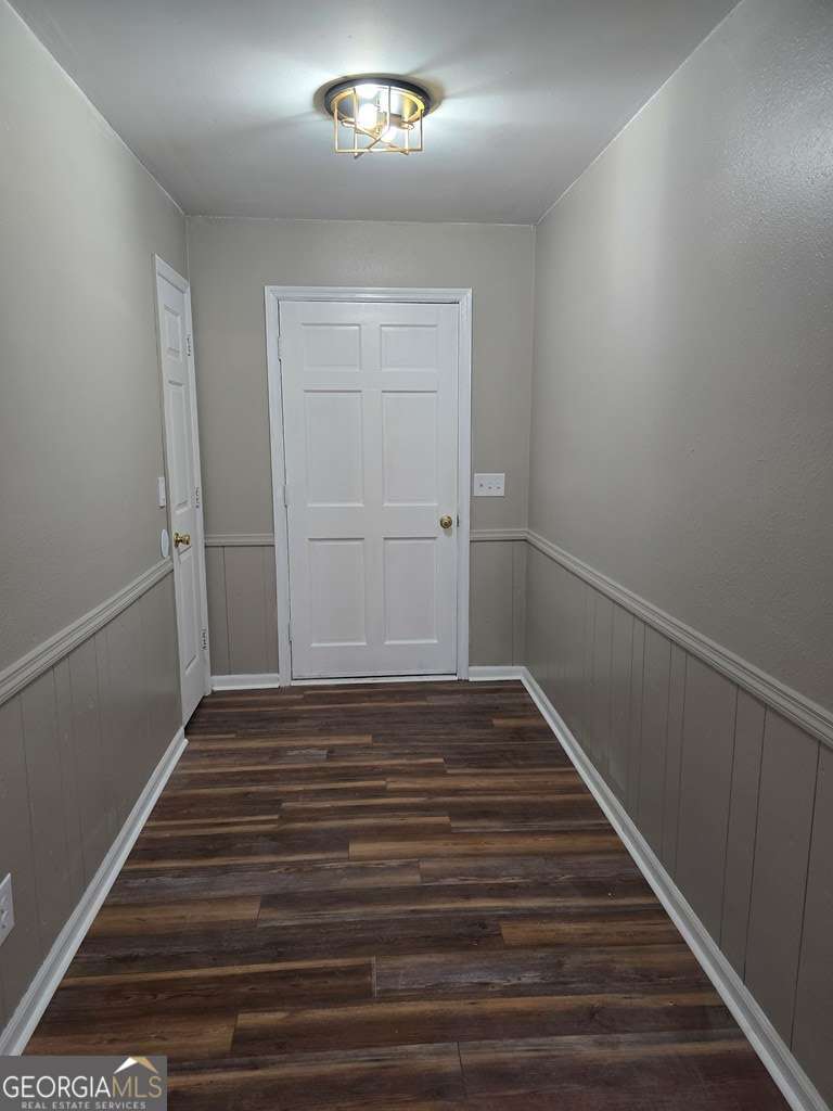 123 Preston Drive Fitzgerald, GA 31750 - Photo 3 of 24 a view of a hallway with wooden floor