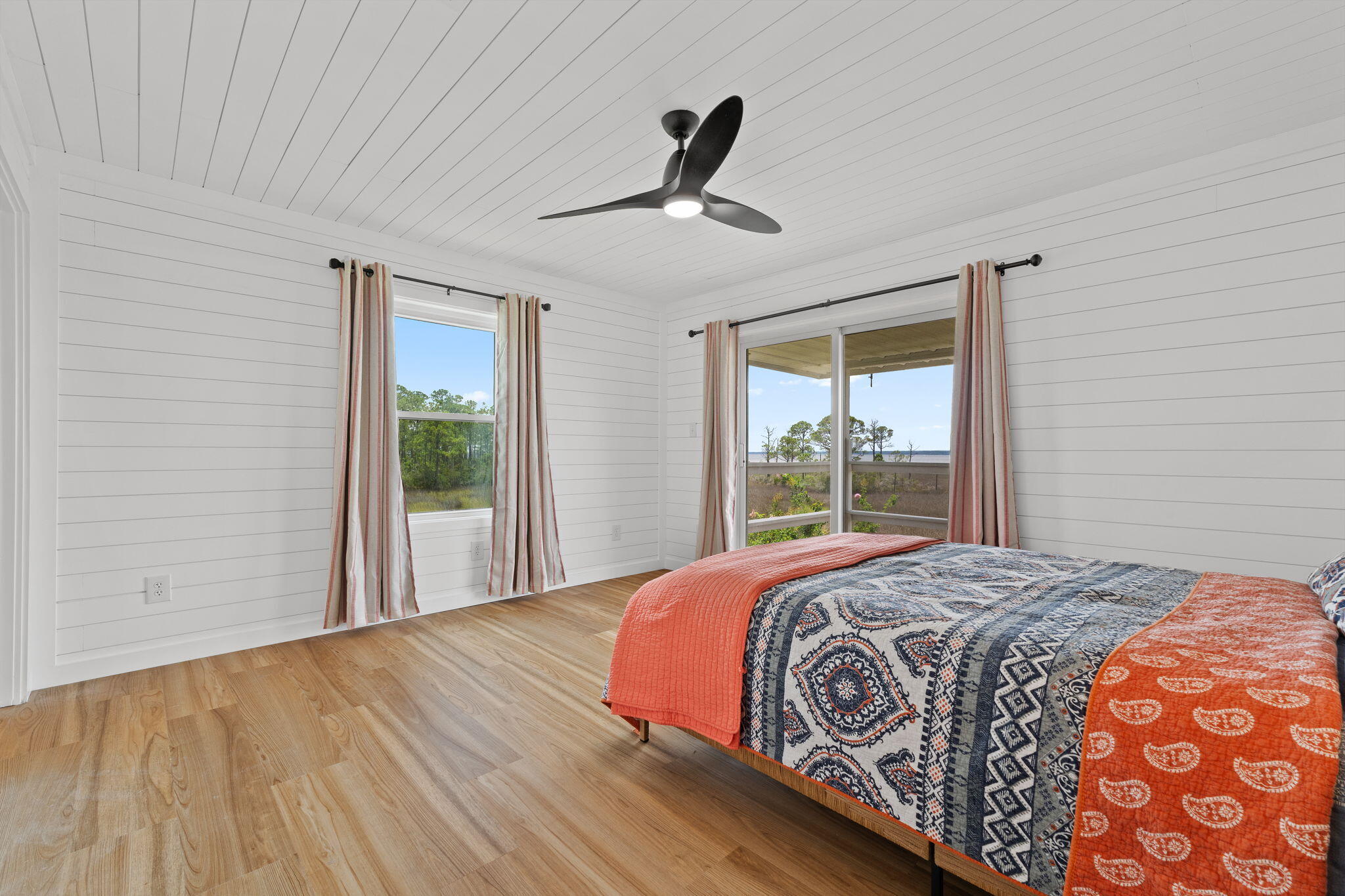 1357 Pearson Road Milton, FL 32583 - Photo 16 of 52 a bedroom with a large bed and a window