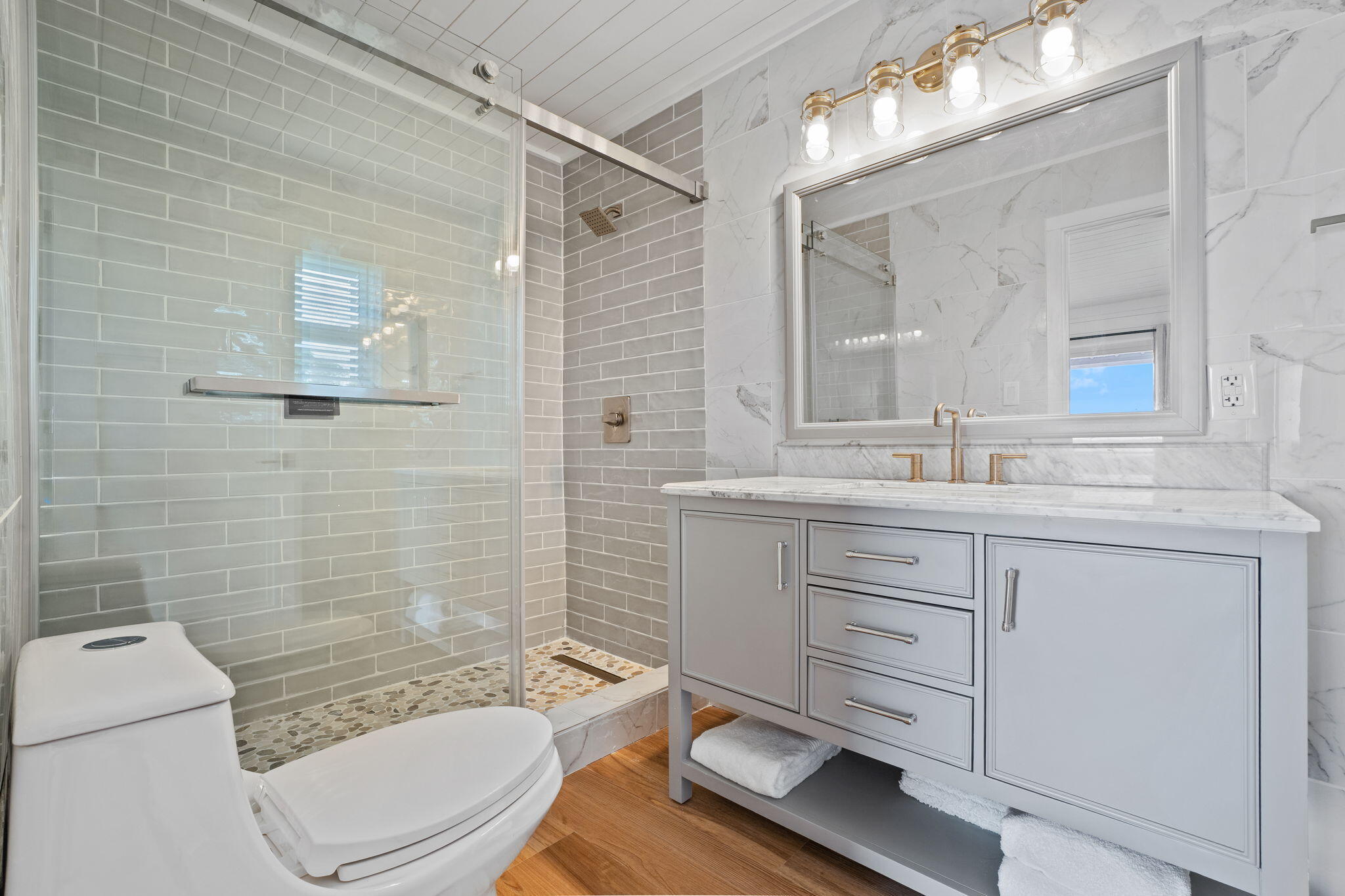 1357 Pearson Road Milton, FL 32583 - Photo 17 of 52 a bathroom with a granite countertop toilet sink and mirror