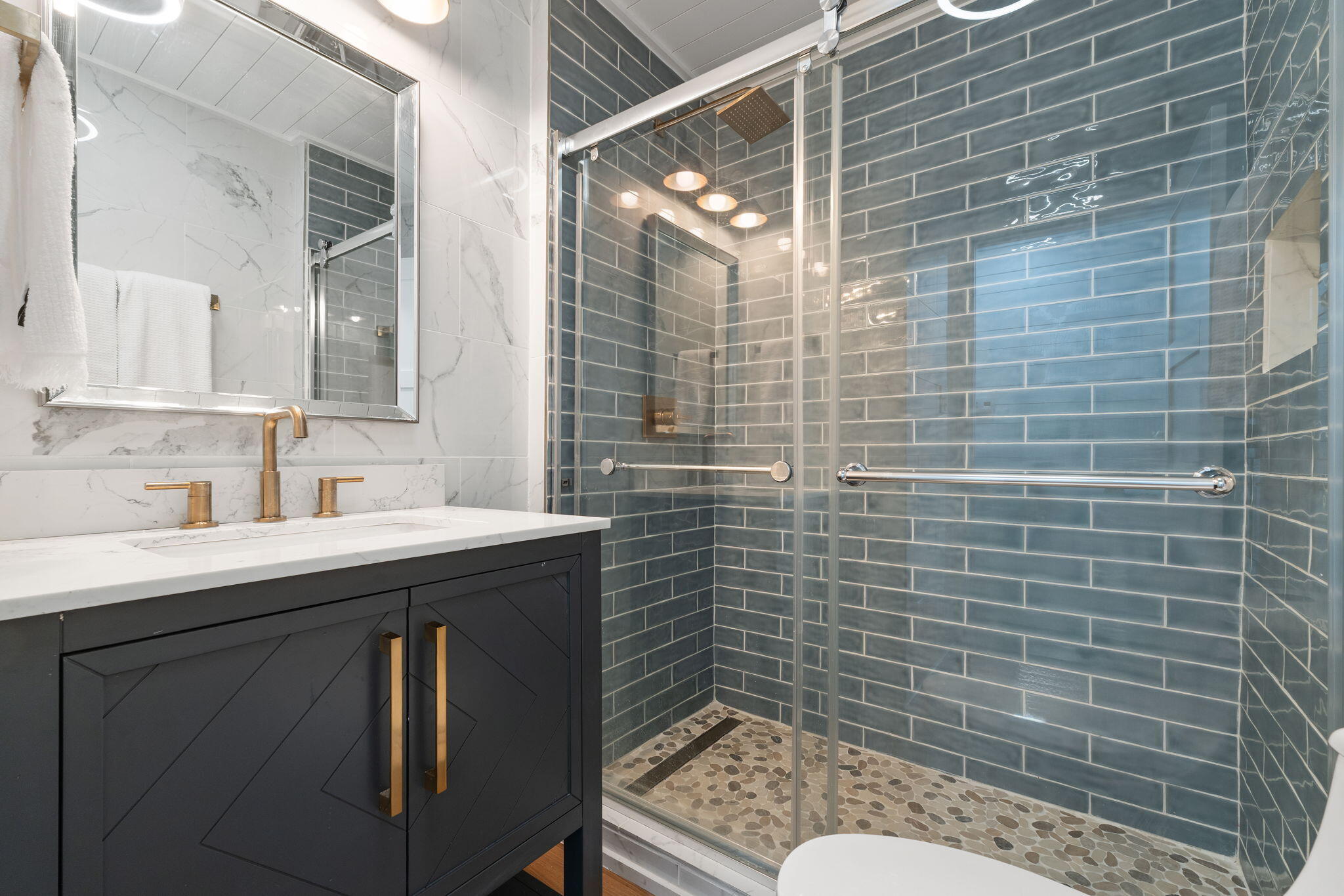 1357 Pearson Road Milton, FL 32583 - Photo 20 of 52 a bathroom with a sink mirror toilet and shower