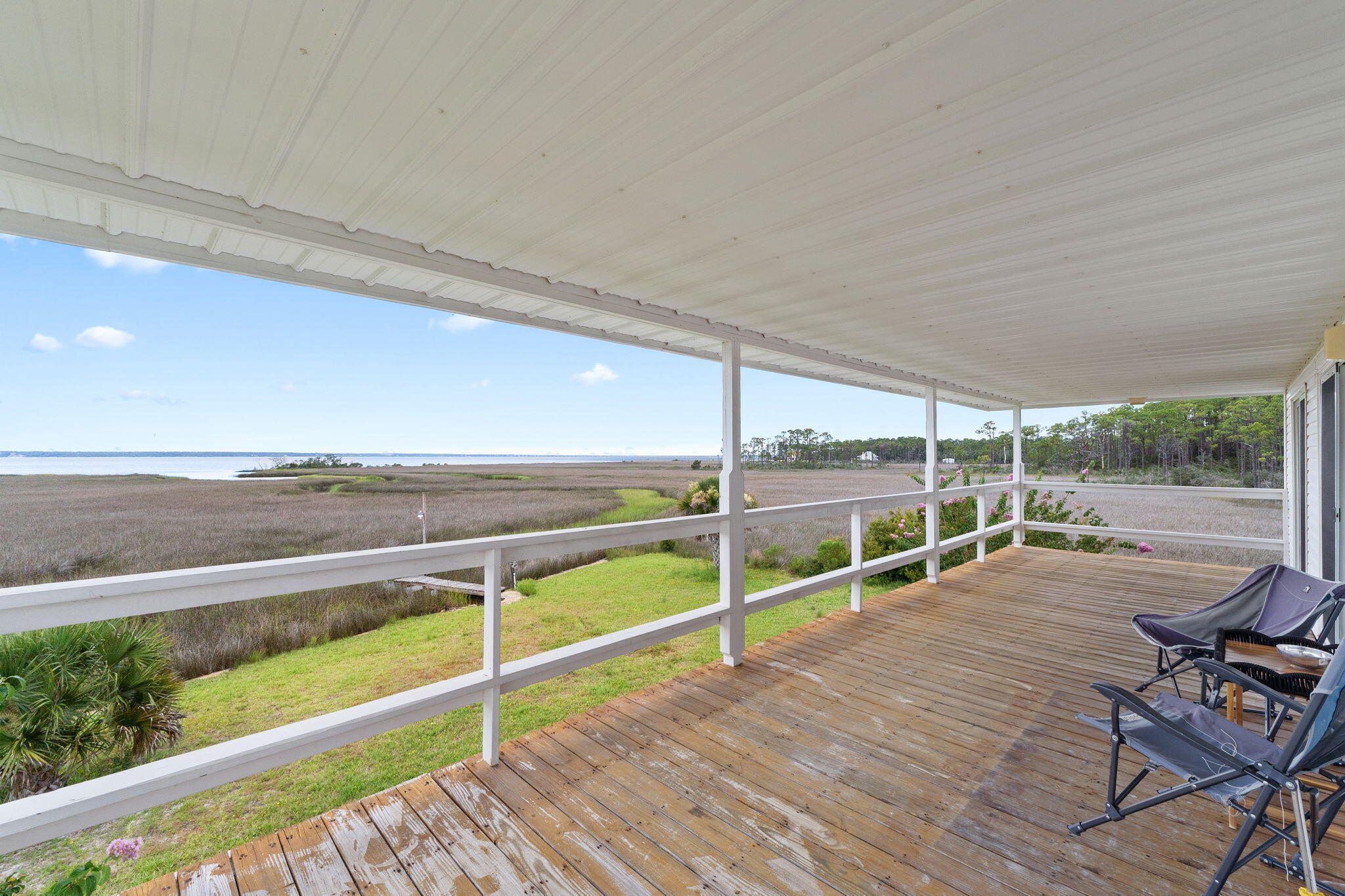 1357 Pearson Road Milton, FL 32583 - Photo 23 of 52 a view of a roof deck with wooden floor and fence