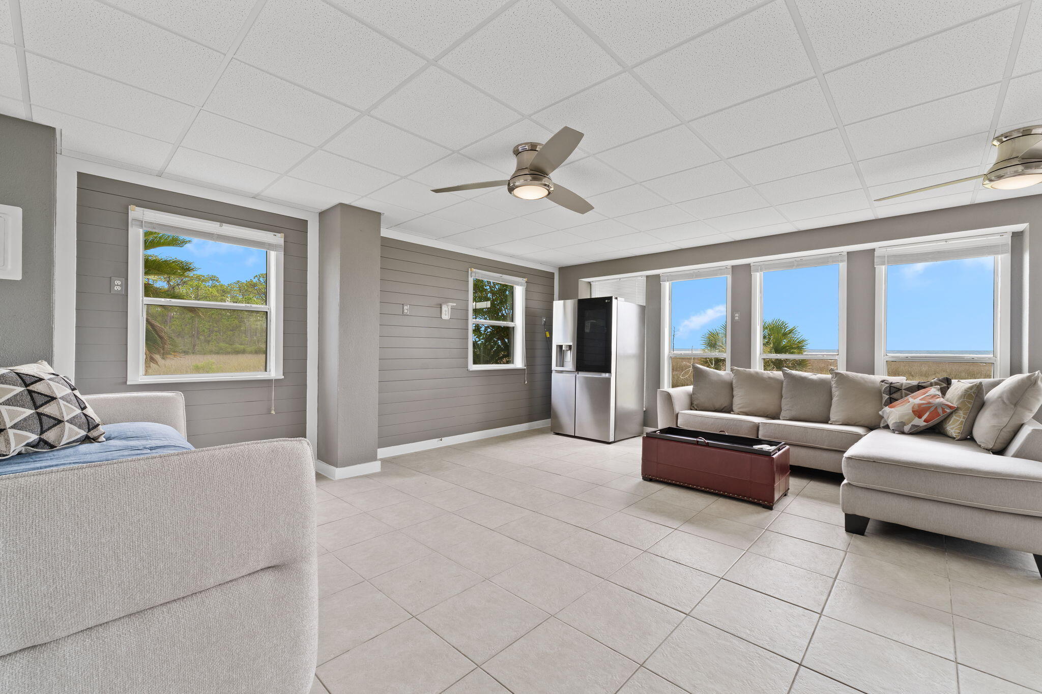 1357 Pearson Road Milton, FL 32583 - Photo 29 of 52 a living room with furniture and a large window
