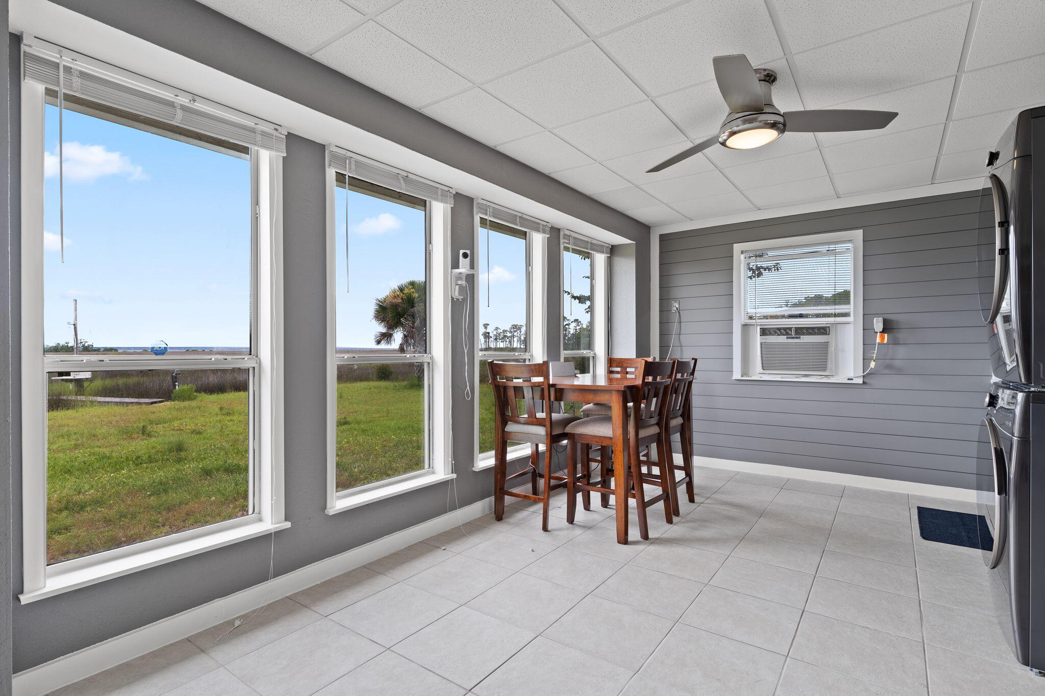 1357 Pearson Road Milton, FL 32583 - Photo 32 of 52 a dining room with furniture and a window