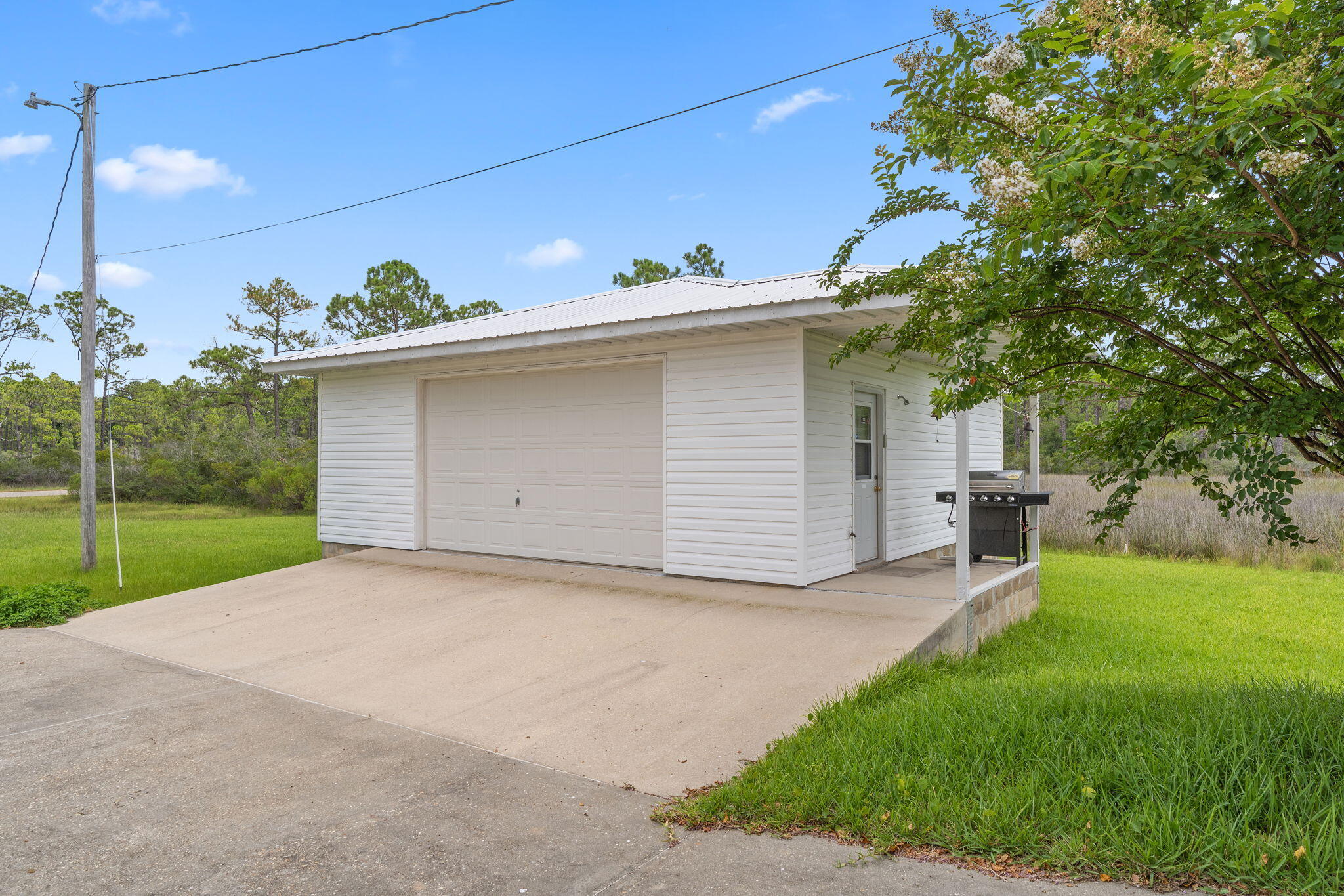 1357 Pearson Road Milton, FL 32583 - Photo 36 of 52 a backyard of a house with table and chairs