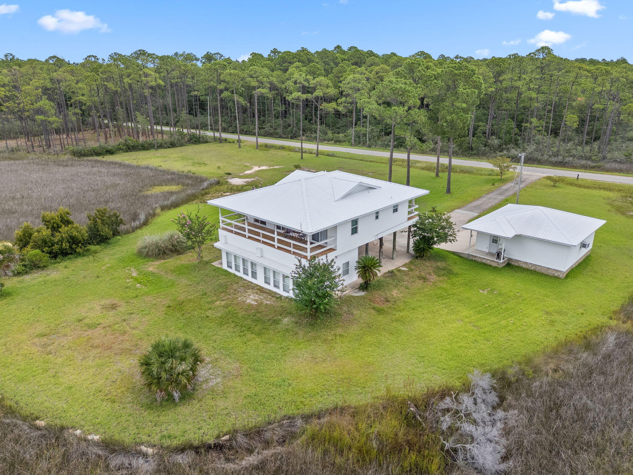 1357 Pearson Road Milton, FL 32583 - Photo 44 of 52 an aerial view of a house with swimming pool