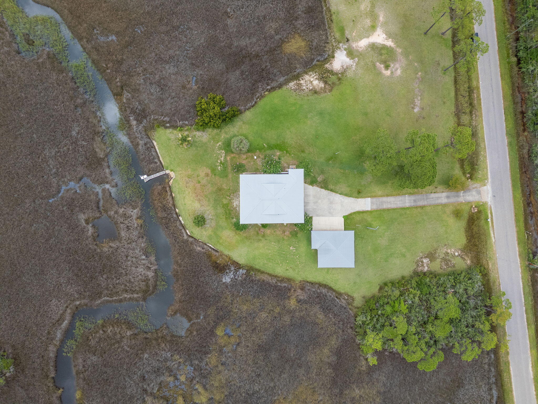 1357 Pearson Road Milton, FL 32583 - Photo 48 of 52 an aerial view of a residential houses with outdoor space
