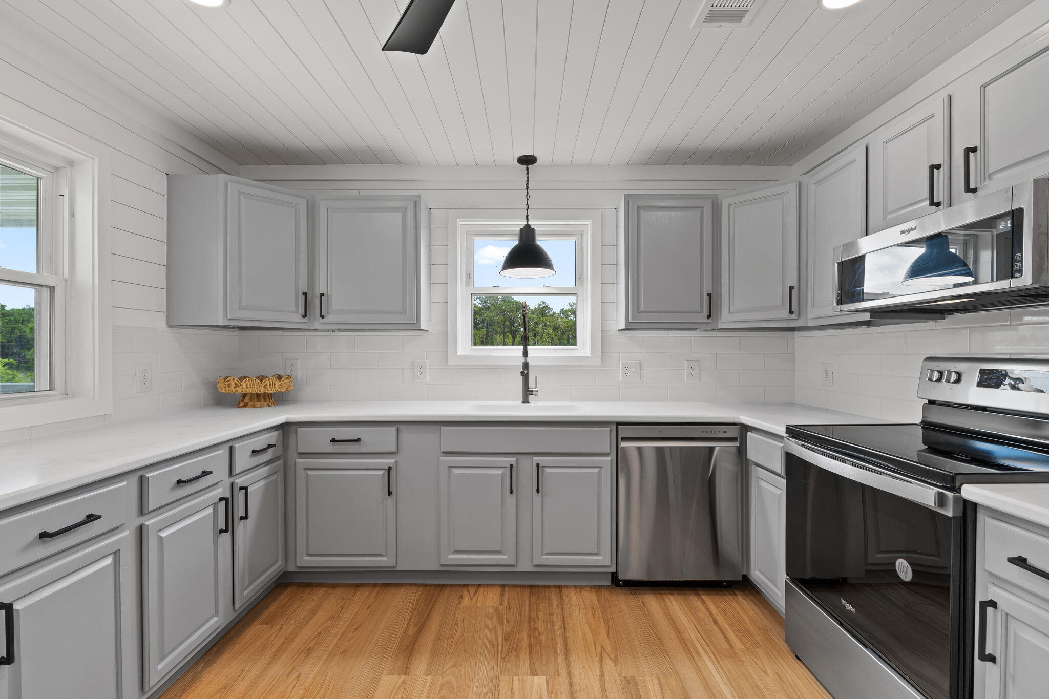 1357 Pearson Road Milton, FL 32583 - Photo 9 of 52 a kitchen with stainless steel appliances granite countertop a sink stove and cabinets