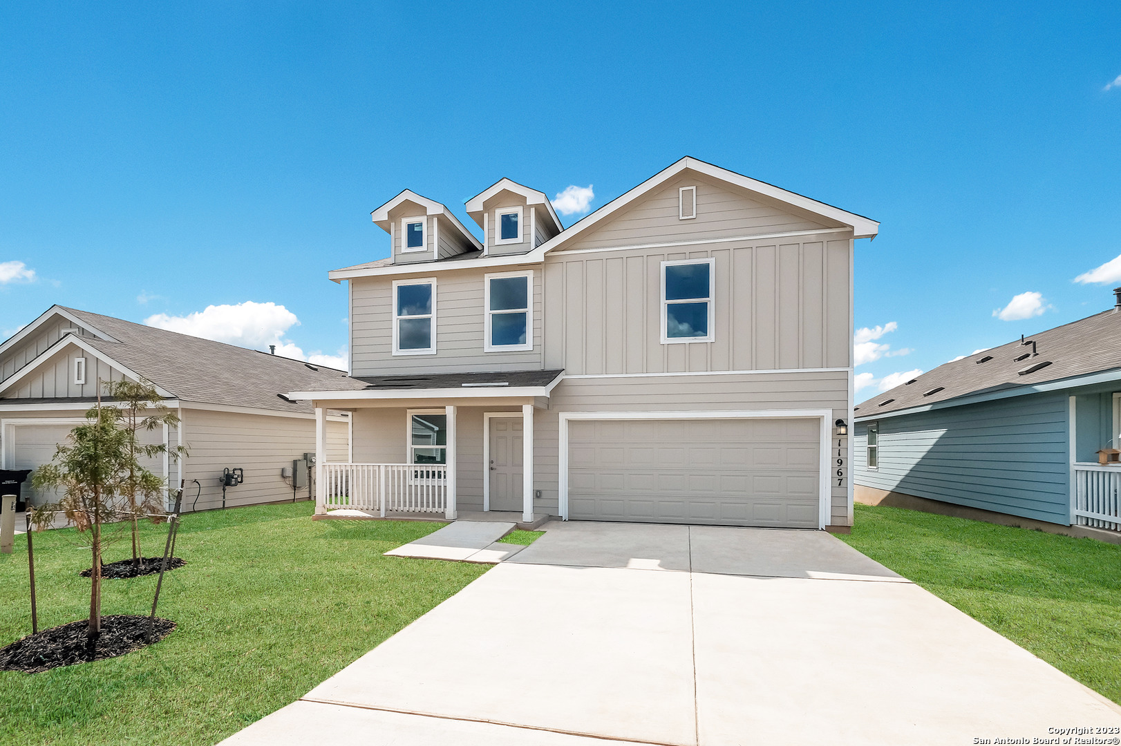 6038 Companion Loop Bulverde, TX 78163 - Photo 1 of 1 a front view of a house with a yard and garage