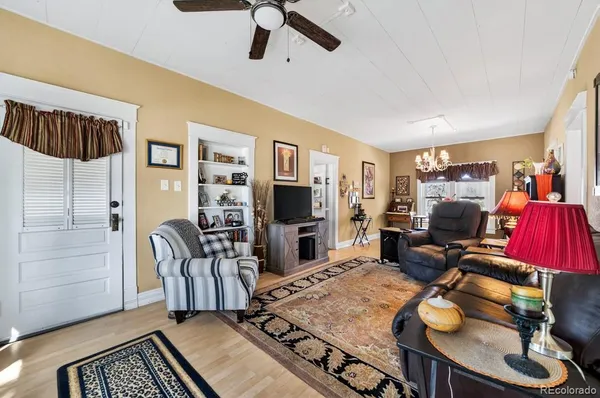 a view of a livingroom with furniture and a flat screen tv