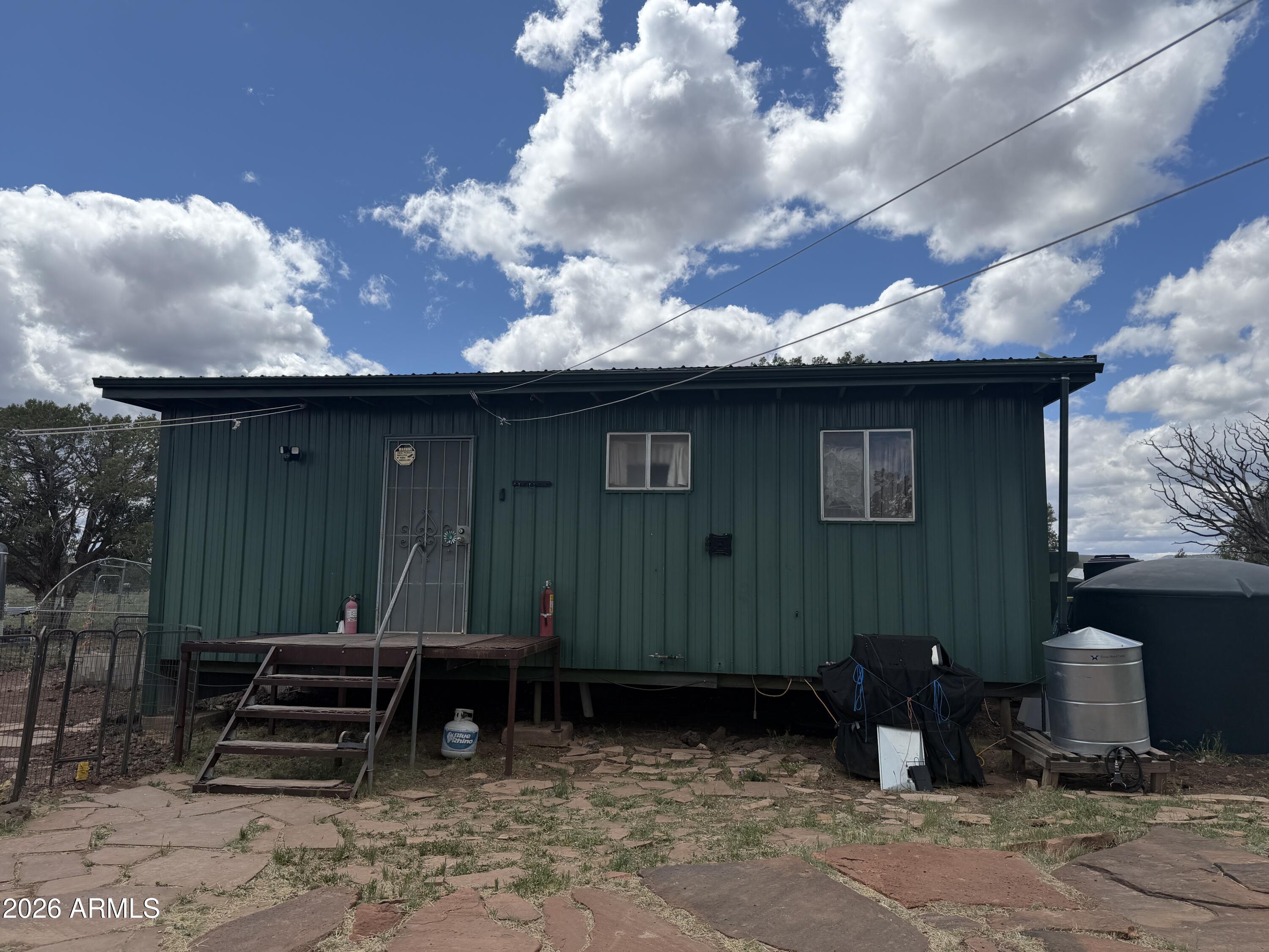 1 Hideaway Road Ash Fork, AZ 86320 - Photo 4 of 43 a front view of a house with garden
