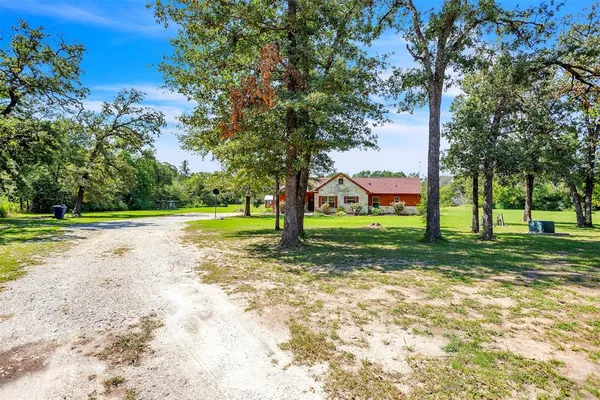 a view of a house with a big yard