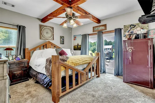 a bed room with a bed and a chandelier