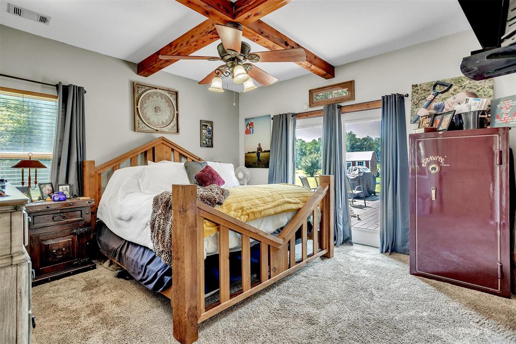 899 Fcr, Unit 930 Teague, TX 75860 - Photo 12 of 28 a bed room with a bed and a chandelier