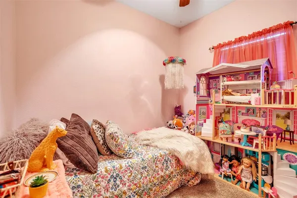 a bedroom with a bed and a book shelf