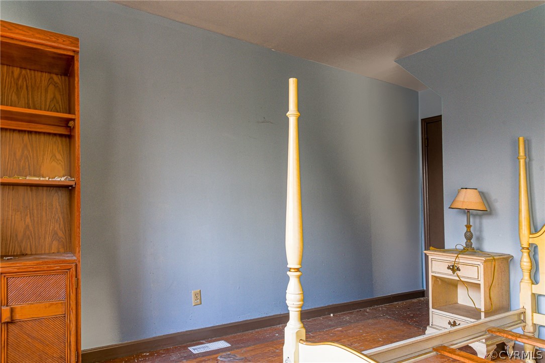 3071 Afton Grove Road Kenbridge, VA 23944 - Photo 7 of 30 a view of a bedroom with wooden floor and a sink