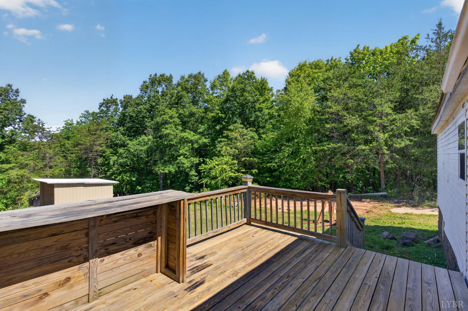 1811 Mohawk Road Gladys, VA 24554 - Photo 37 of 51 a view of deck with wooden floor and fence next to a yard