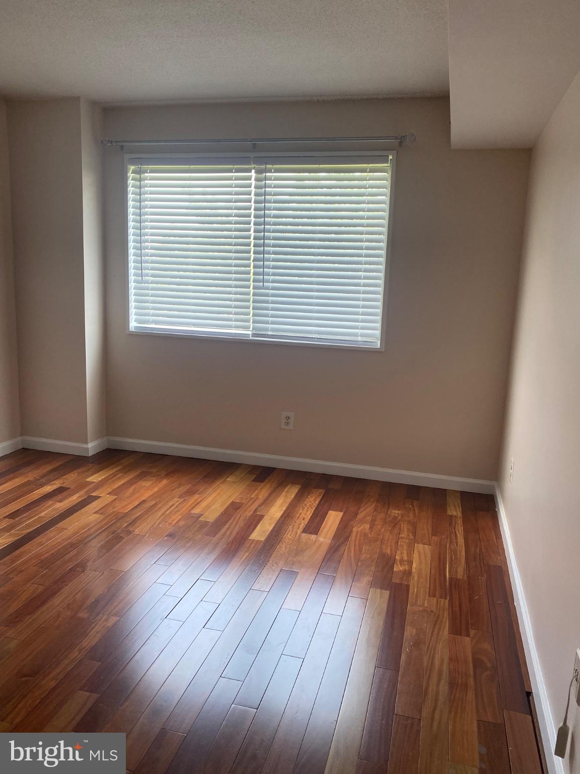 1836 Metzerott Road, Unit 707 Hyattsville, MD 20783 - Photo 9 of 13 Bright and airy room with hardwood floors.