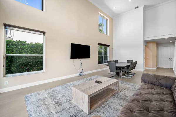 a view of a livingroom with a ceiling fan and window