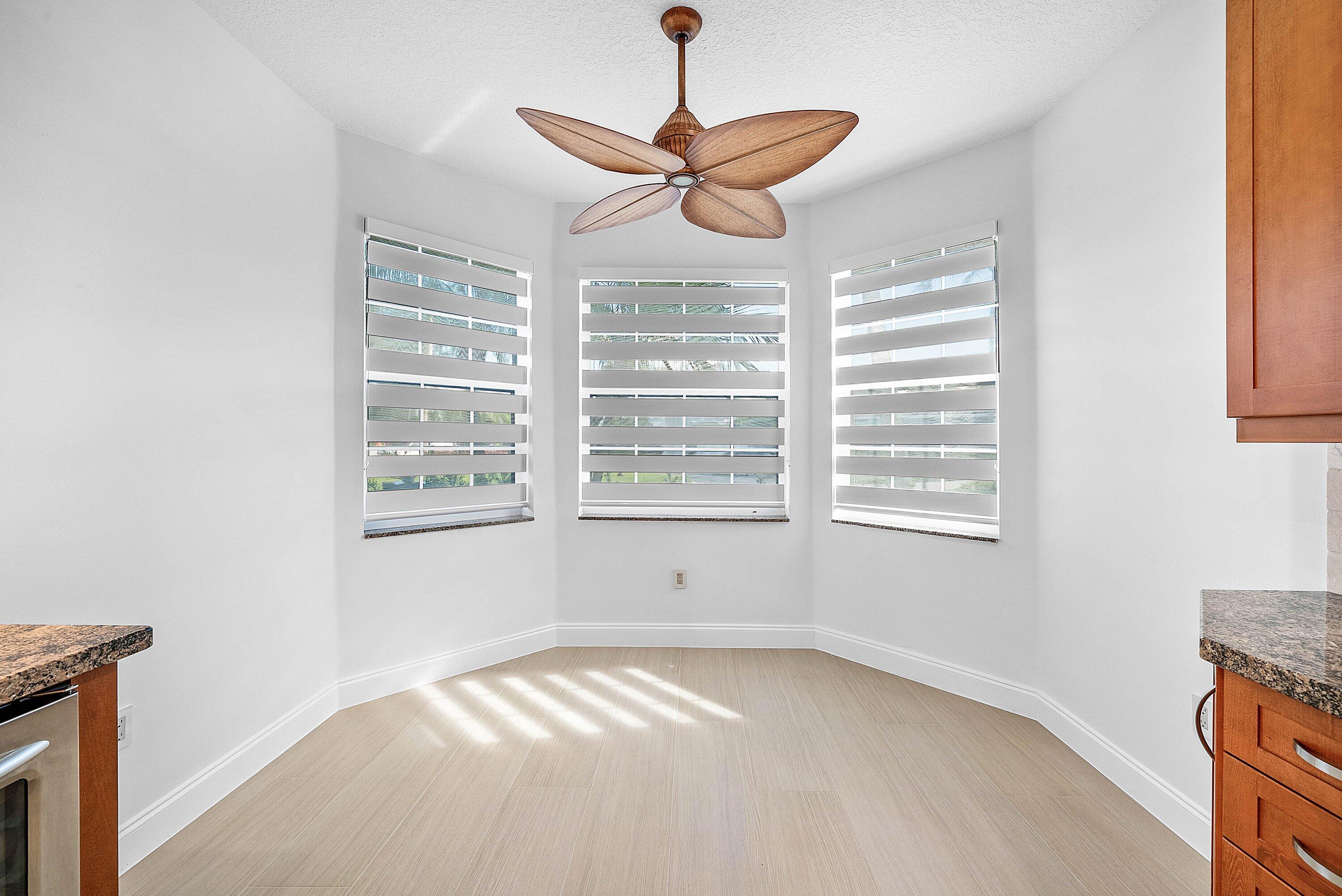 5855 Northwest 42nd Way Boca Raton, FL 33496 - Photo 15 of 77 a view of a livingroom with a ceiling fan and window