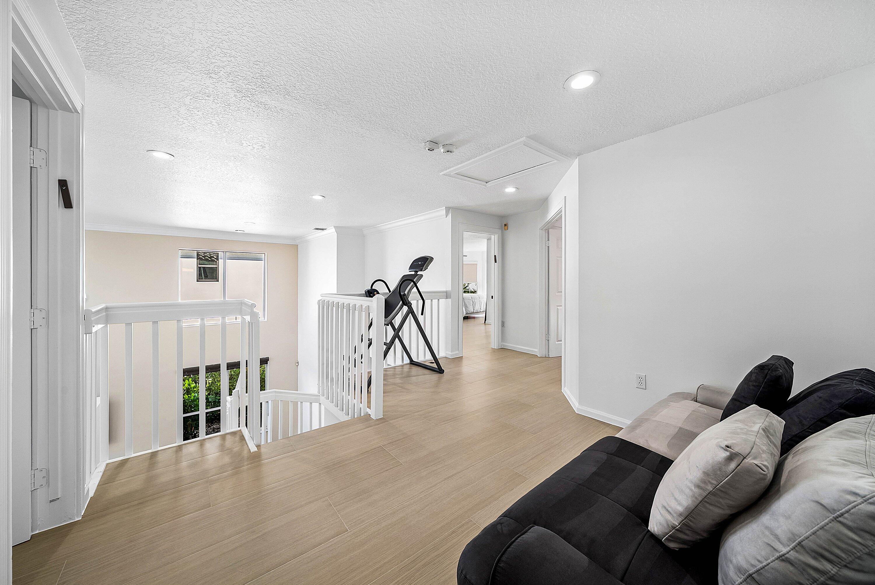 5855 Northwest 42nd Way Boca Raton, FL 33496 - Photo 25 of 77 a living room with furniture and a wooden floor