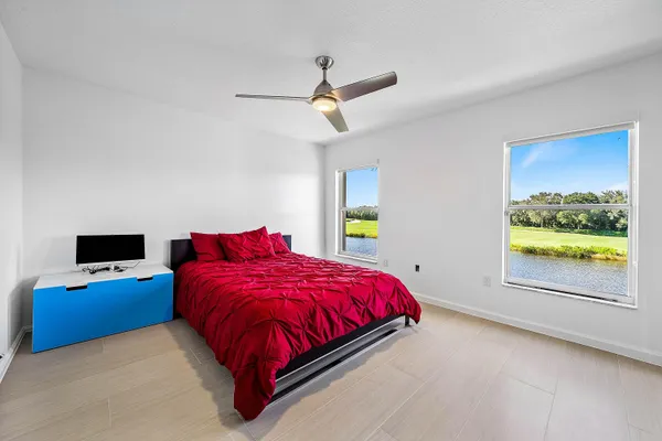 a front view of a house with a garden and plants