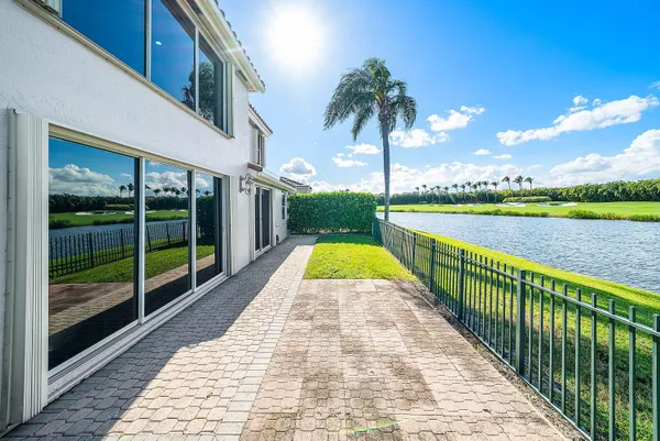 a front view of a house with a swimming pool
