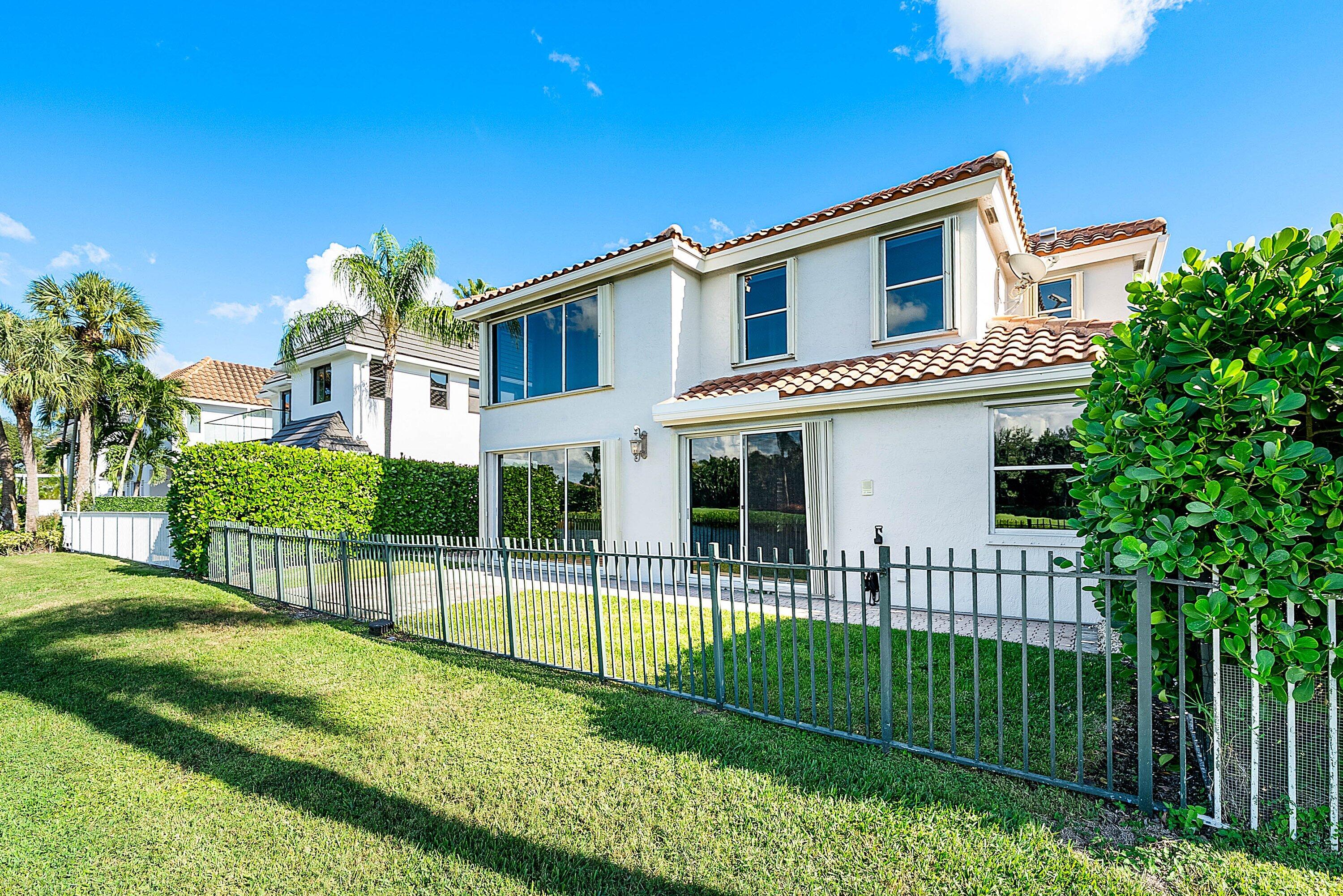 5855 Northwest 42nd Way Boca Raton, FL 33496 - Photo 44 of 77 a front view of a house with a garden and plants