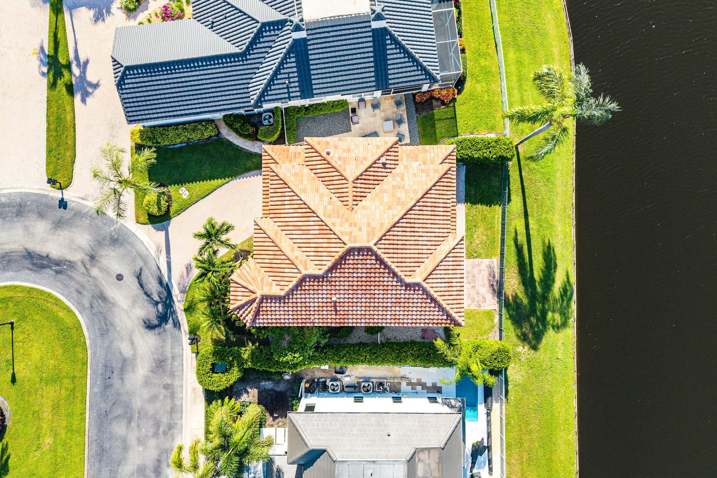 5855 Northwest 42nd Way Boca Raton, FL 33496 - Photo 48 of 77 an aerial view of a house with swimming pool and large trees