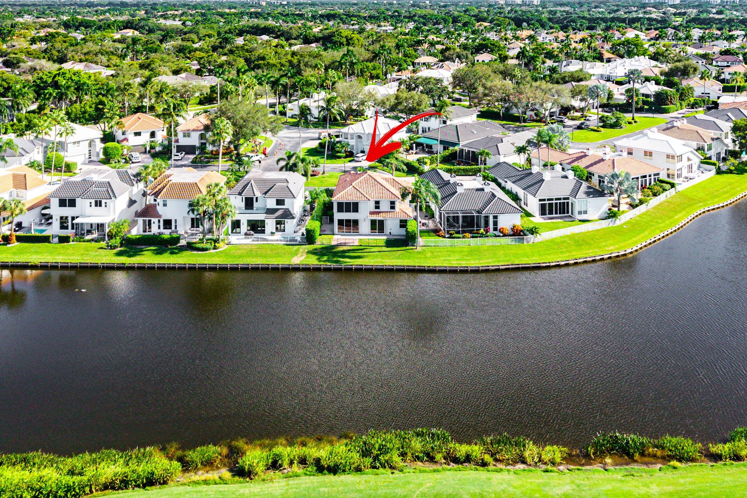5855 Northwest 42nd Way Boca Raton, FL 33496 - Photo 54 of 77 an aerial view of a house with a garden and lake view