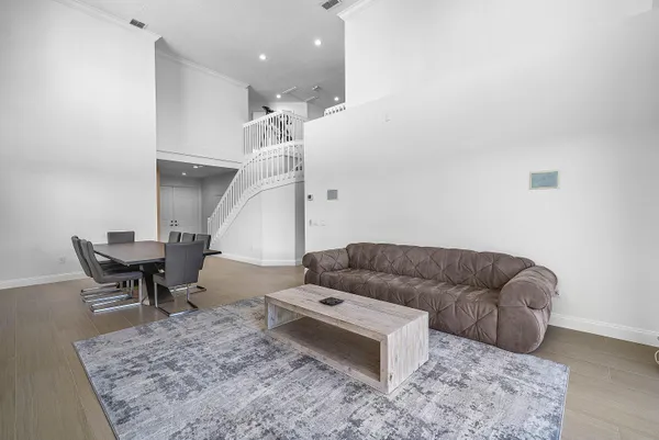 a kitchen with stainless steel appliances granite countertop wooden cabinets a stove top oven a sink and dishwasher