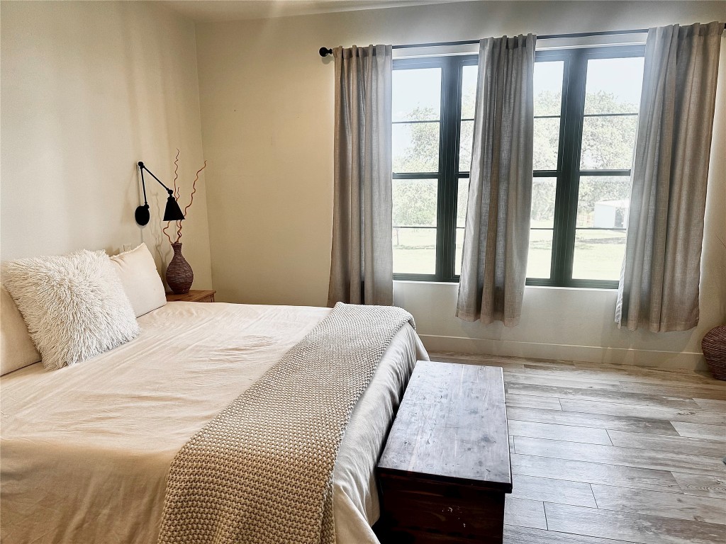 621 Stanton Road Johnson City, TX 78636 - Photo 15 of 40 a bedroom with a bed window and walk in closet