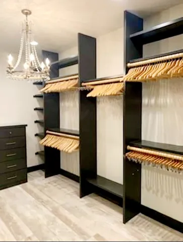 a kitchen with stainless steel appliances kitchen island a chandelier